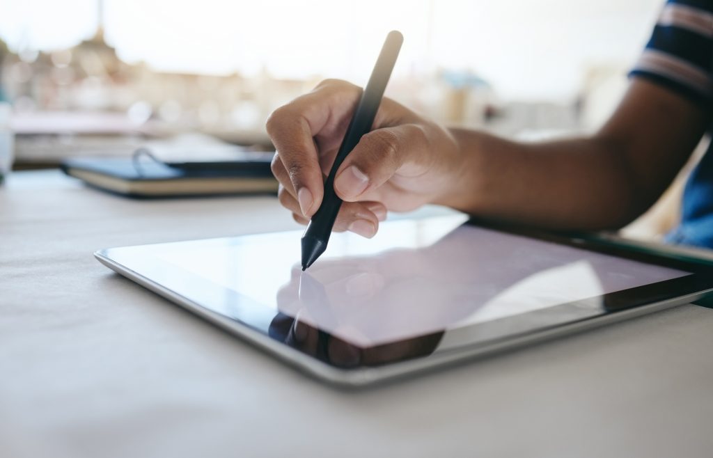 Digital tablet, designer hands writing with pen for design planning, creative animation or advertis